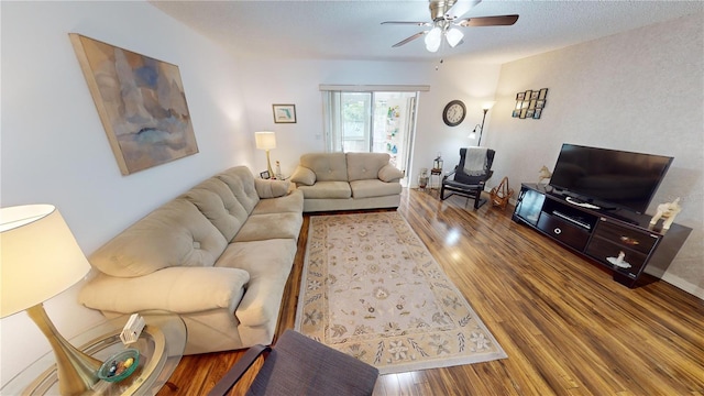 living room with hardwood / wood-style flooring and ceiling fan