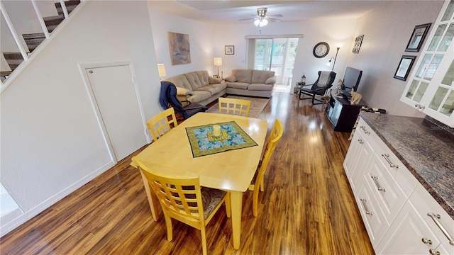 dining room featuring dark hardwood / wood-style floors and ceiling fan