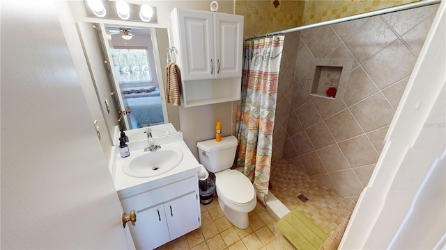 bathroom featuring a shower with curtain, tile patterned floors, vanity, and toilet