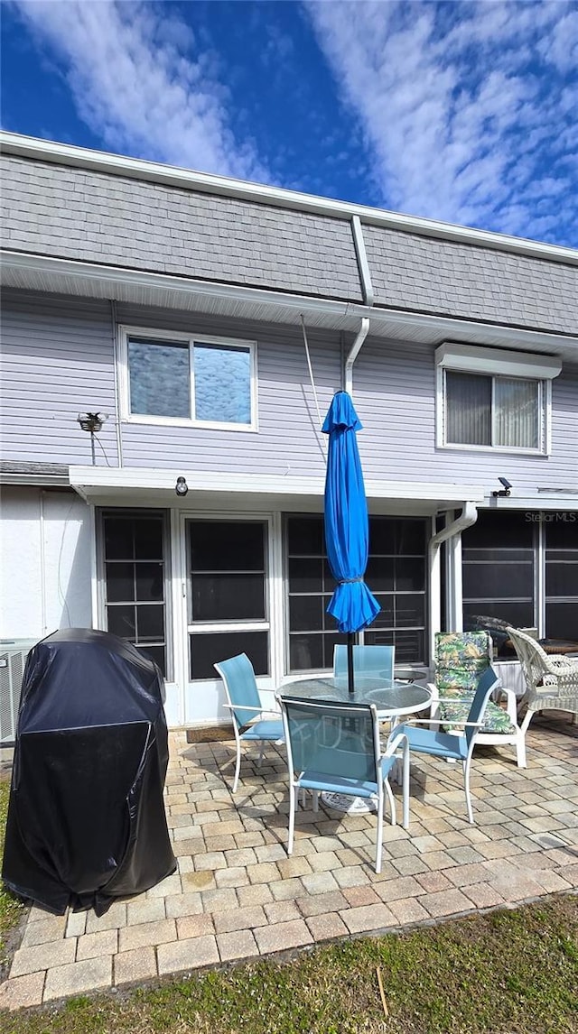 back of house with a patio area