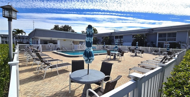 view of pool featuring a patio area