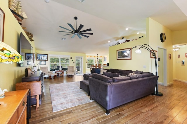 living room featuring lofted ceiling and ceiling fan