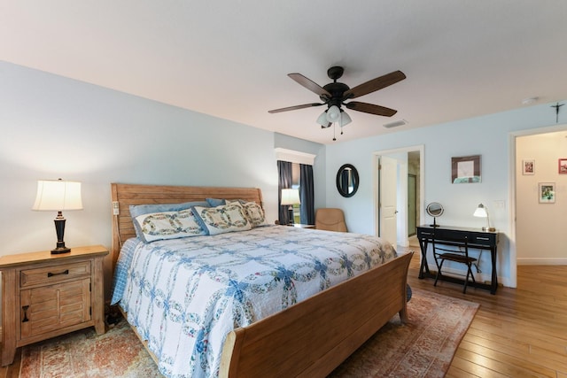 bedroom with ceiling fan and light wood-type flooring