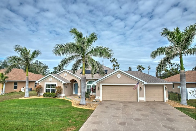 single story home with a garage and a front lawn