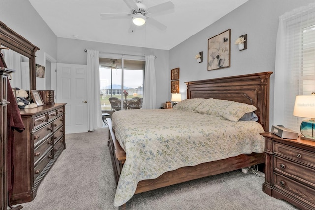 carpeted bedroom with access to exterior and ceiling fan