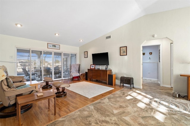 living room with vaulted ceiling