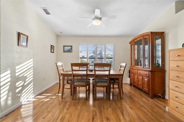 dining space featuring ceiling fan and light wood-type flooring