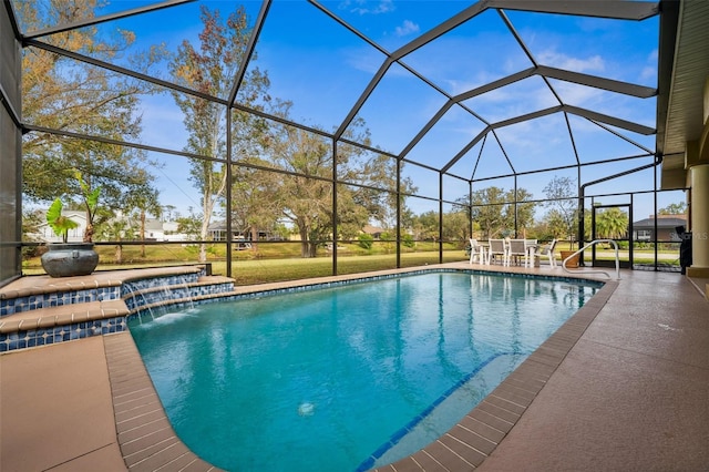 view of swimming pool with a patio, pool water feature, glass enclosure, and a lawn