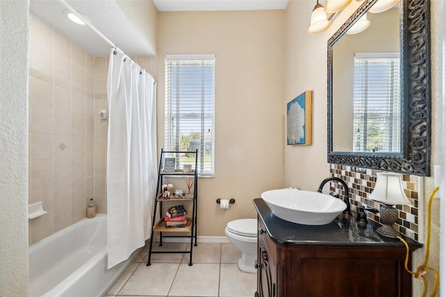 full bathroom featuring toilet, vanity, shower / bathtub combination with curtain, tile patterned flooring, and backsplash