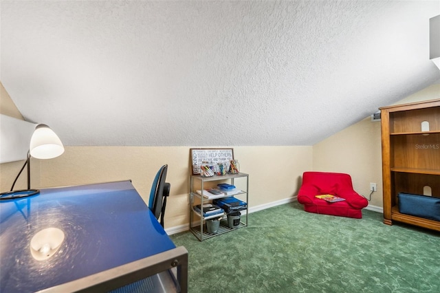 carpeted office space featuring vaulted ceiling and a textured ceiling