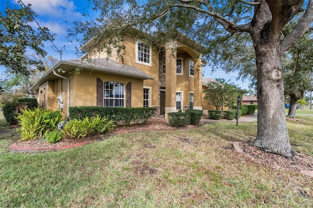 view of front of home featuring a front lawn