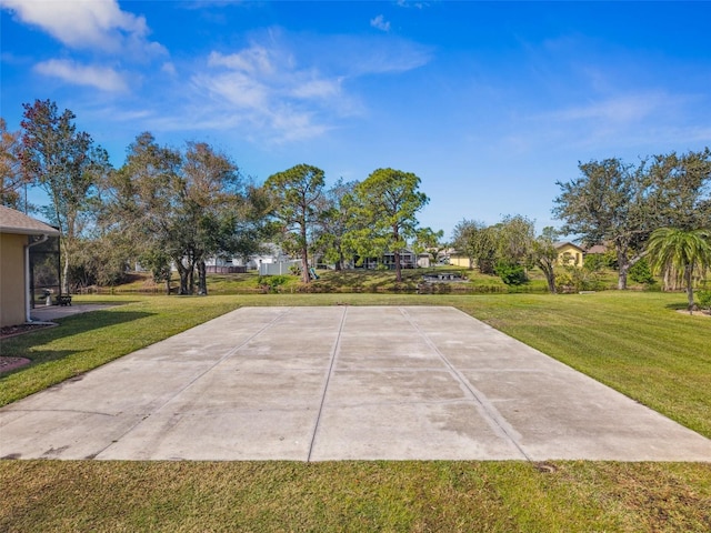 view of patio featuring basketball hoop