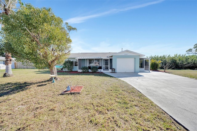 ranch-style house featuring a garage and a front yard