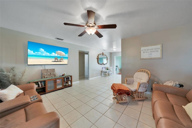 living room with light tile patterned floors and ceiling fan