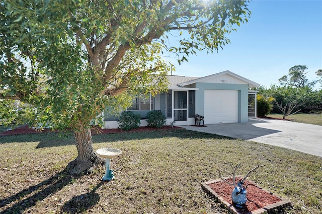 view of front of property with a garage and a front yard