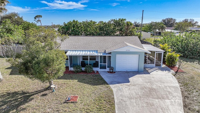 ranch-style house with a garage and a front lawn