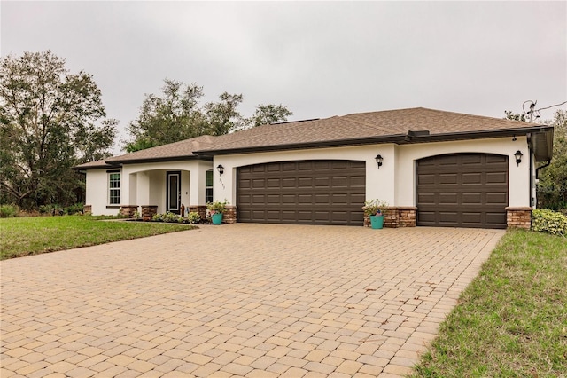 view of front of home featuring a garage and a front yard