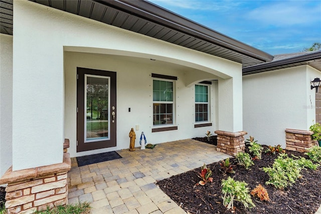 doorway to property with a patio area