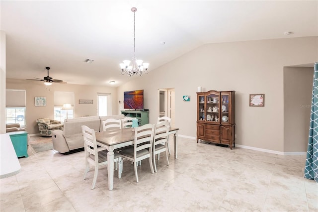 dining area with lofted ceiling and ceiling fan with notable chandelier