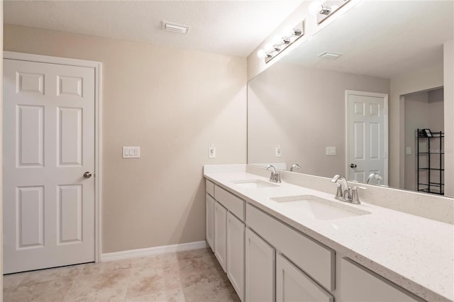 bathroom featuring vanity and a textured ceiling