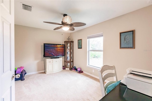 carpeted home office with ceiling fan