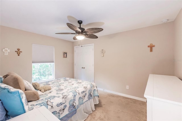 bedroom with light colored carpet and ceiling fan