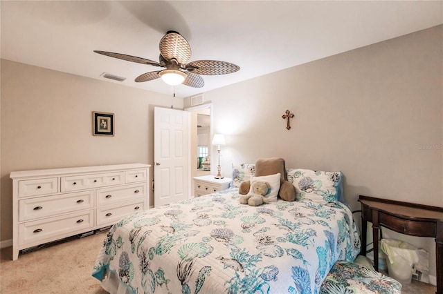 bedroom featuring ceiling fan and light carpet