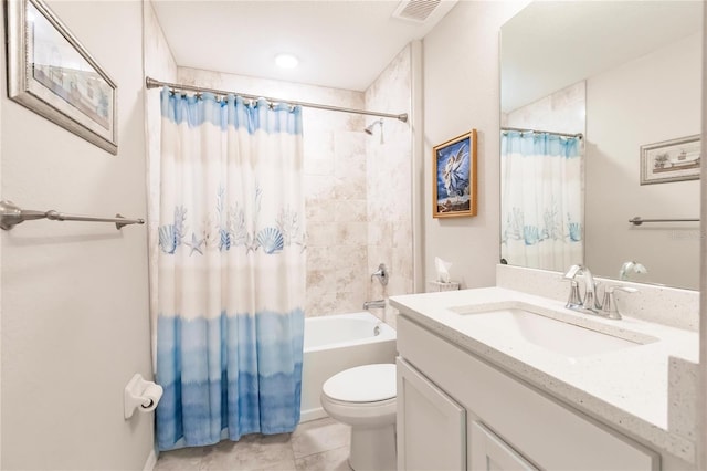 full bathroom featuring shower / bath combination with curtain, tile patterned floors, vanity, and toilet