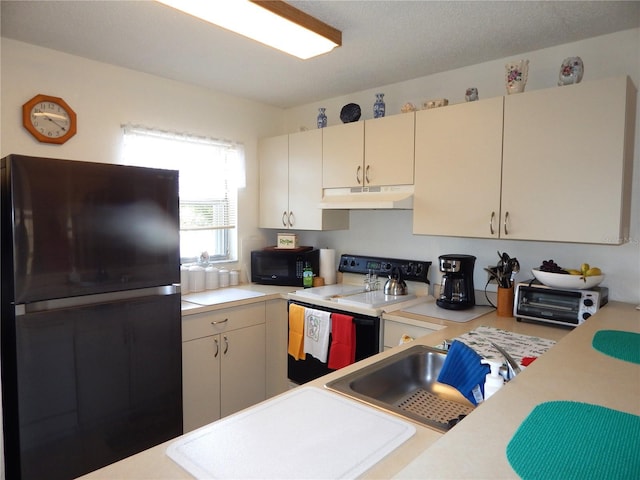 kitchen featuring sink and black appliances