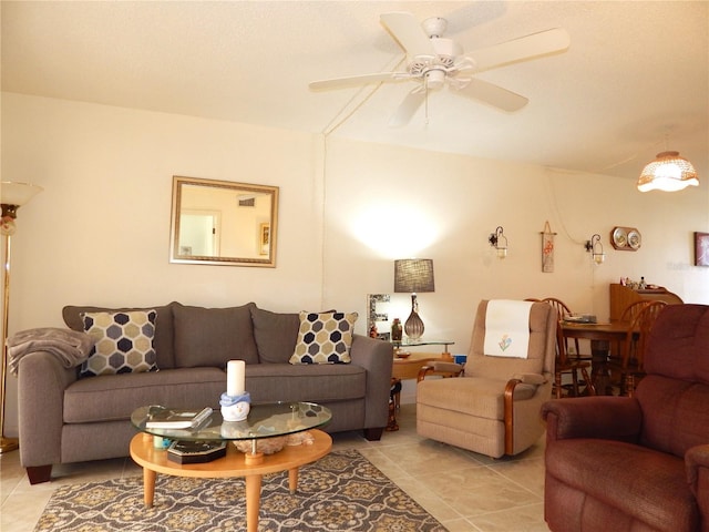 tiled living room with ceiling fan