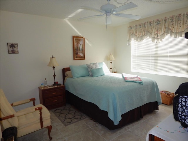 tiled bedroom with ceiling fan