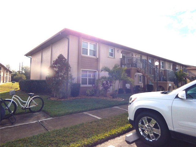 view of home's exterior with a yard