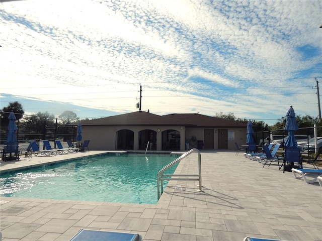 view of swimming pool with a patio