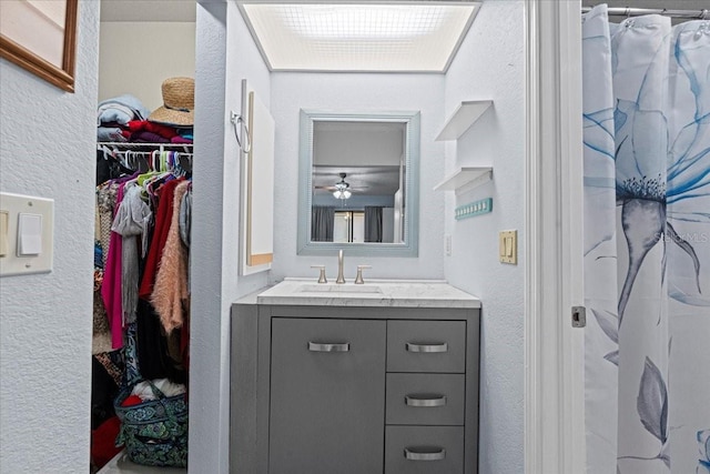 bathroom with vanity and a shower with shower curtain