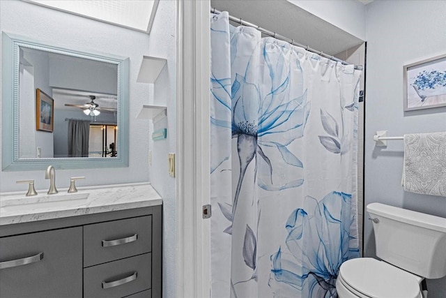 bathroom with a shower with curtain, vanity, and toilet