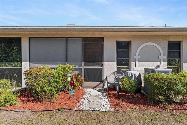 doorway to property with central AC