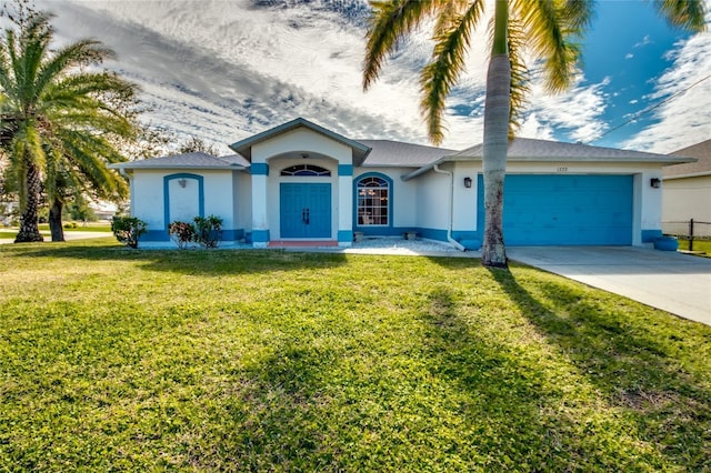 single story home featuring a garage and a front yard