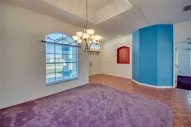 unfurnished room featuring tile patterned flooring, vaulted ceiling, and an inviting chandelier