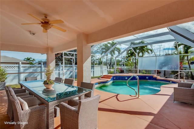 view of pool featuring a lanai, a patio, and ceiling fan