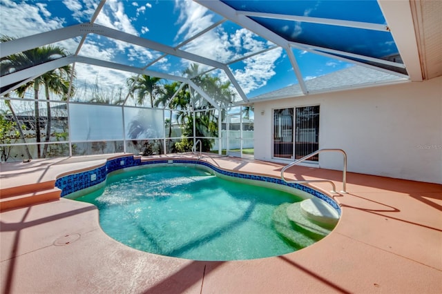 view of pool with a patio and a lanai