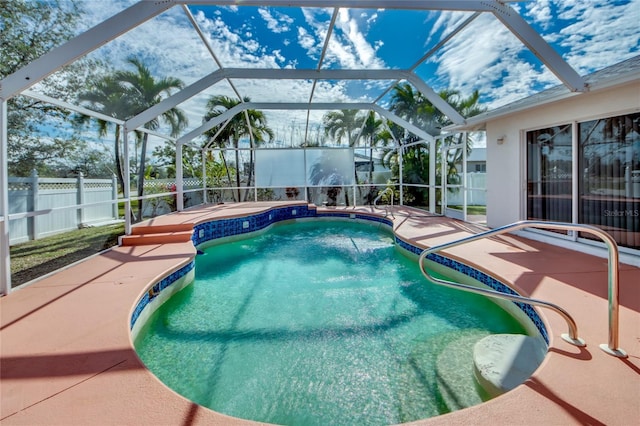 view of swimming pool with a lanai and a patio