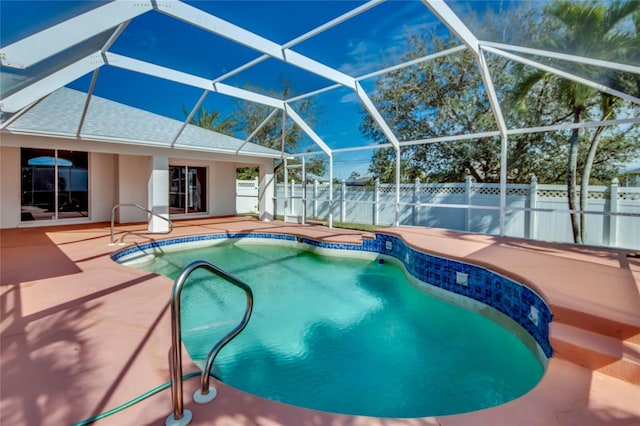 view of swimming pool with a lanai and a patio area