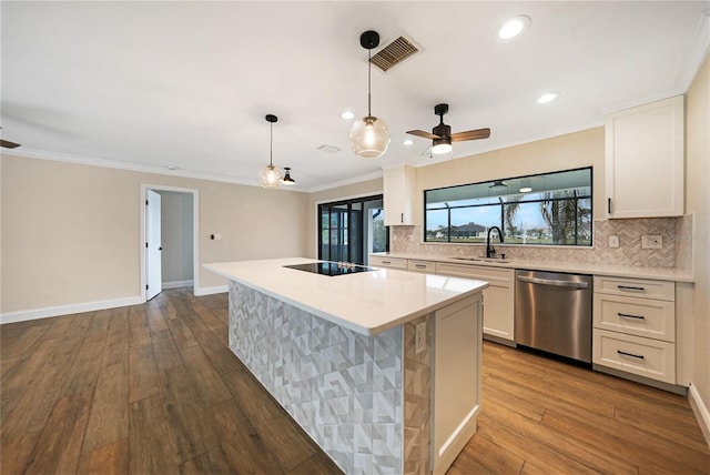 kitchen featuring white cabinetry, hanging light fixtures, a center island, and dishwasher