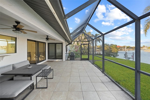 unfurnished sunroom featuring a healthy amount of sunlight and a water view