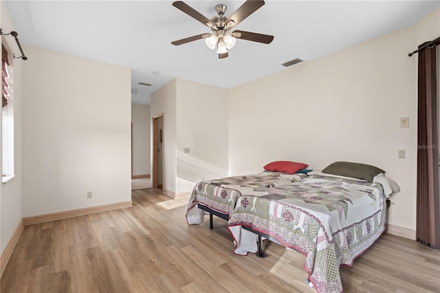 bedroom featuring ceiling fan and light hardwood / wood-style flooring