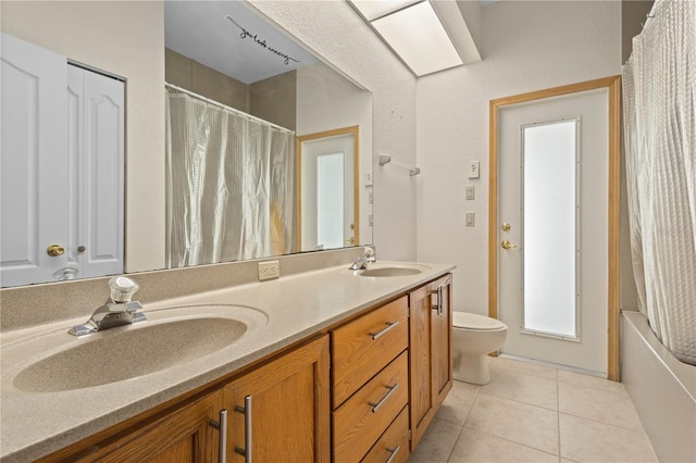 full bathroom with vanity, tile patterned flooring, toilet, and shower / tub combo with curtain