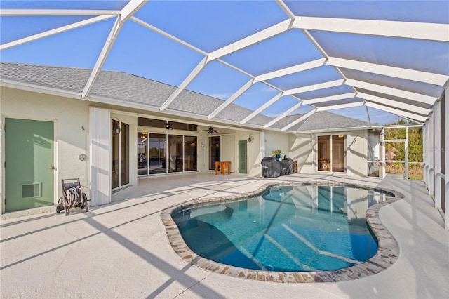 view of swimming pool with a lanai, a patio, and ceiling fan