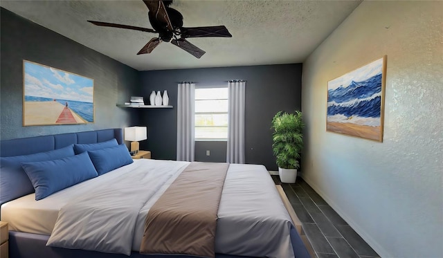 bedroom featuring ceiling fan and a textured ceiling