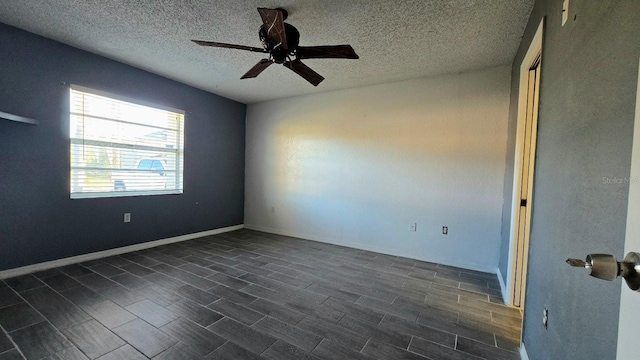 spare room with ceiling fan and a textured ceiling