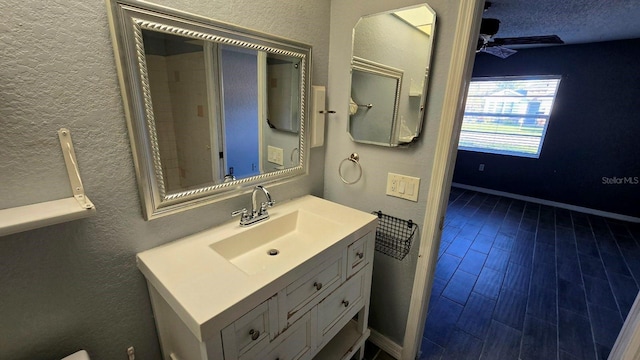 bathroom featuring vanity and ceiling fan